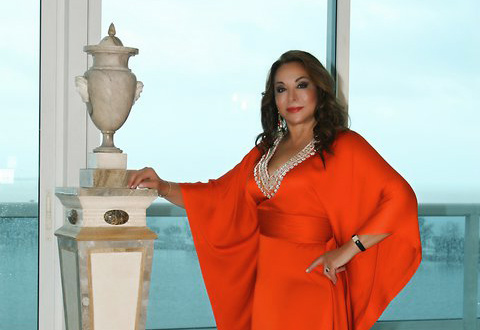 Evangeline in her home on Brickell Avenue in Miami, the background is the beautiful Biscayne Bay and Biscayne Island. Photo was taken as part of a photo shoot for a cover story for the Brickell Magazine.
